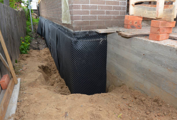Happy homeowners after waterproofing job in Wheeling